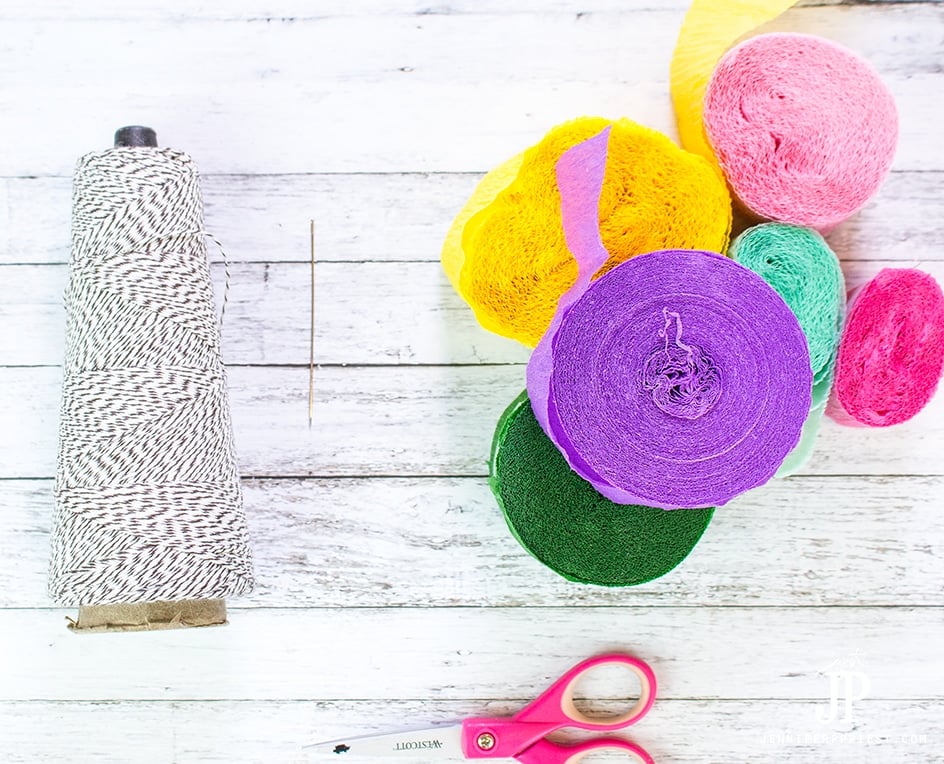 Three free DIY Crepe paper flower tutorials you will love - she shows how to make these flowers in SECONDS with cheap crepe paper! PLUS more tutorials with a flower theme from 5 other YouTubers.