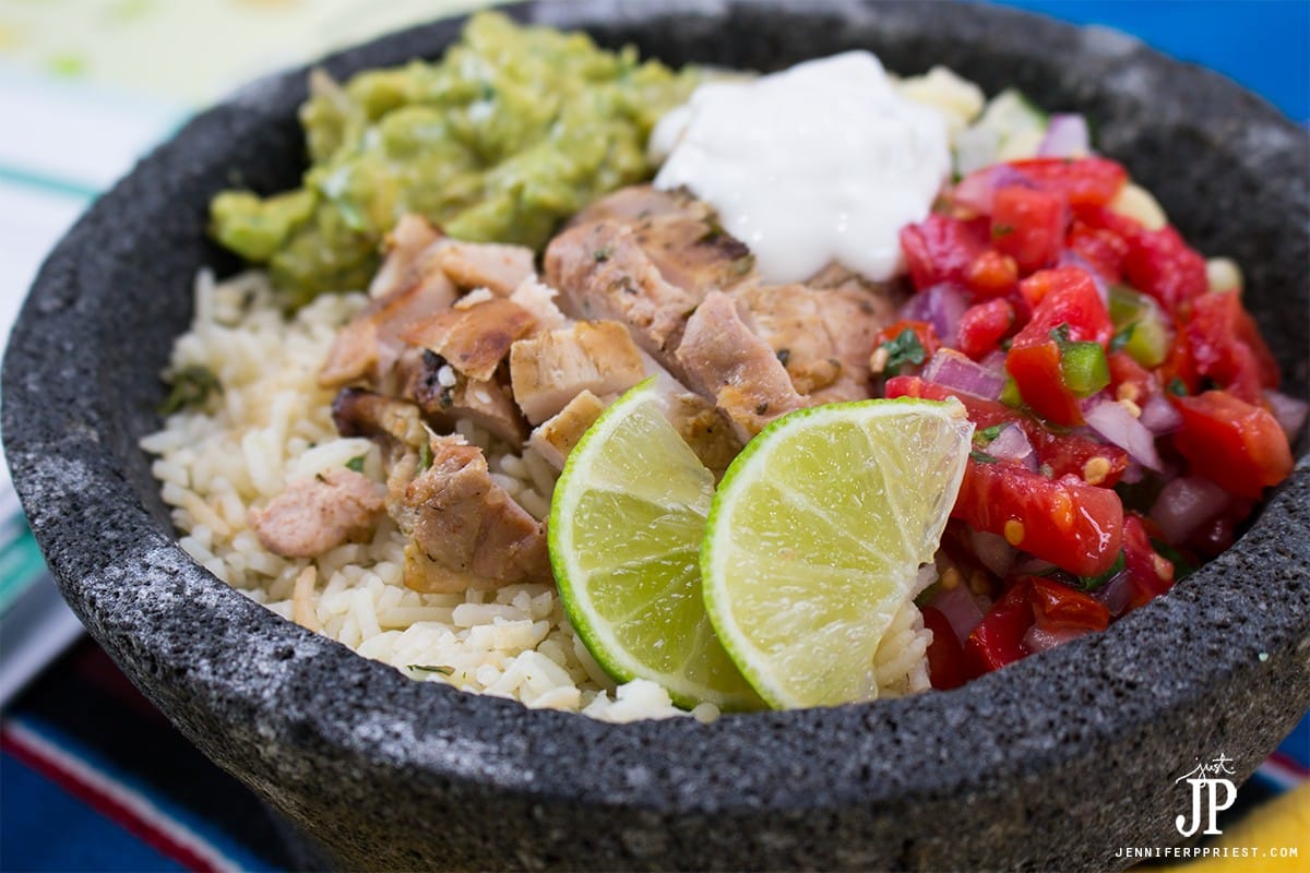 Chicken burrito bowl recipe - make it at home! Healthy burrito bowl PLUS creamy guacamole that you don't have to to pay EXTRA for!
