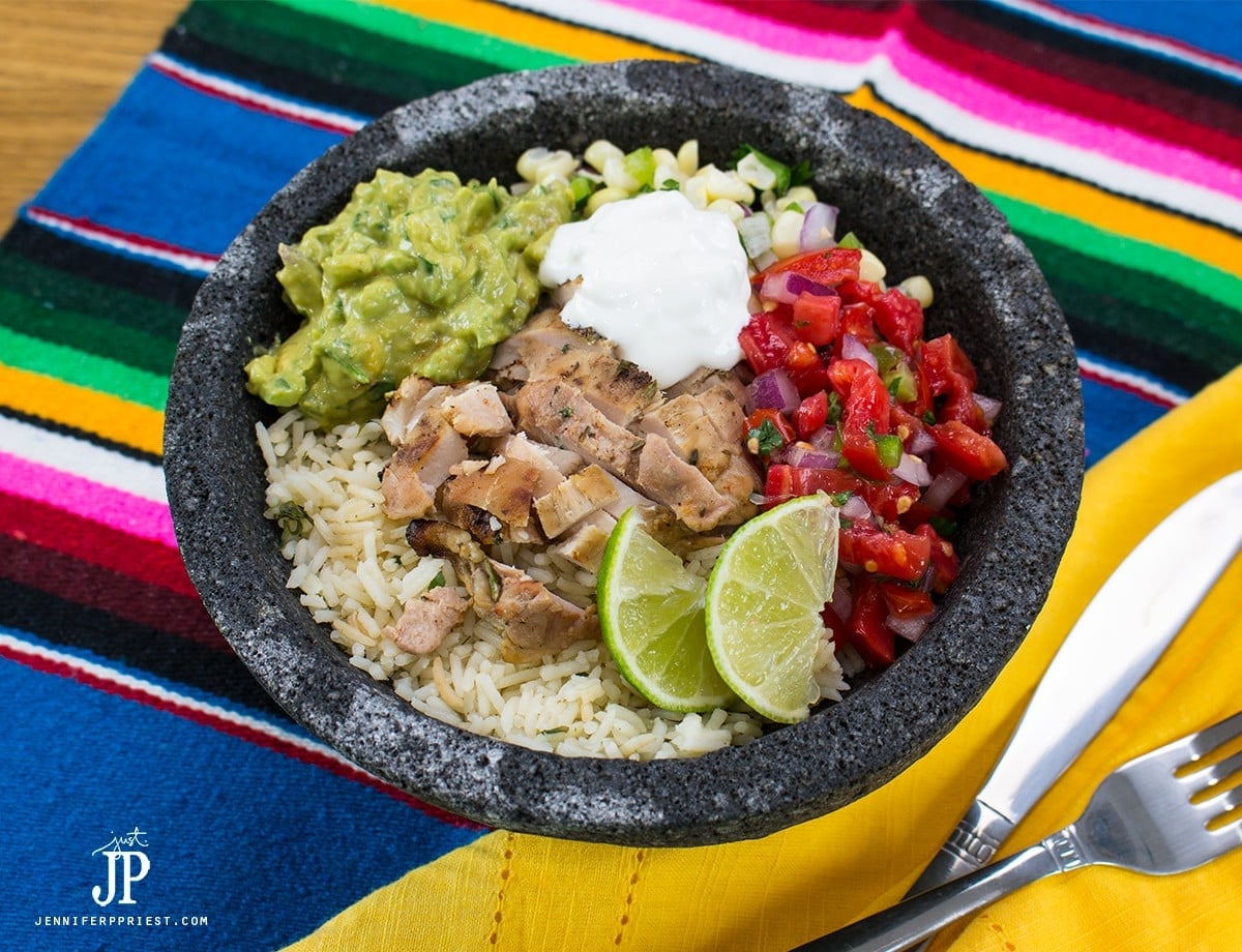 Healthy DIY chicken burrito bowl - make it at home! Healthy burrito bowl PLUS creamy guacamole that you don't have to to pay EXTRA for!
