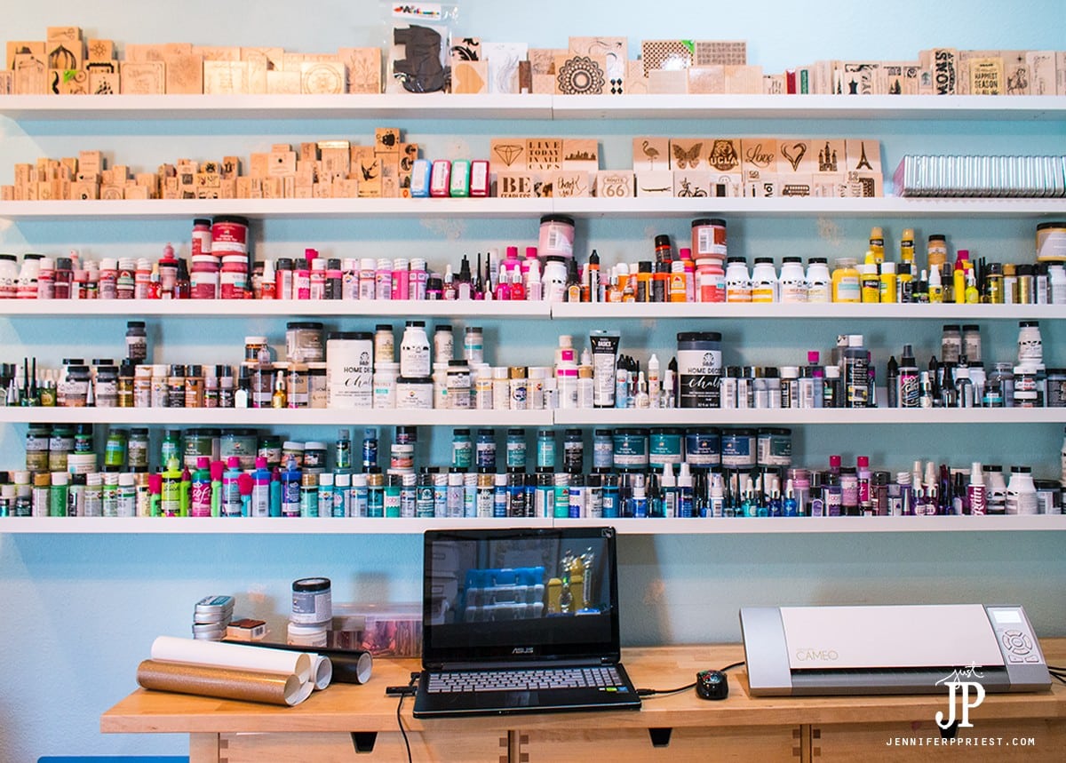 Paint and stamps stored on IKEA Mosslanda frame shelves