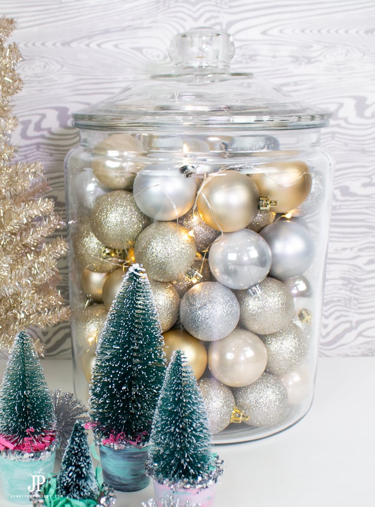 Tips for decorating your mantle on a budget - use what you have and get bulk ornaments to fill vases and more. This look? Under $10 to make!