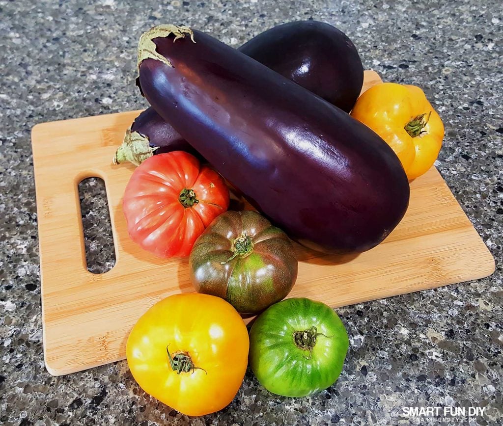 Heirloom tomatoes and eggplant. Grilled eggplant and heirloom tomato salad recipe https://www.smartfundiy.com/mothers-day-lunch-grilled-eggplant/ #SoWorthIt