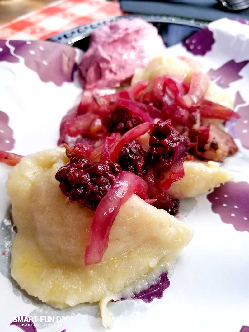 Boysenberry Pierogies with boysenberry sour cream and boysenberry onion compote on top