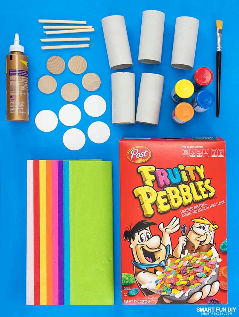Supplies to make DIY confetti poppers covered with tissue paper and filled with Fruity Pebbles Cereal