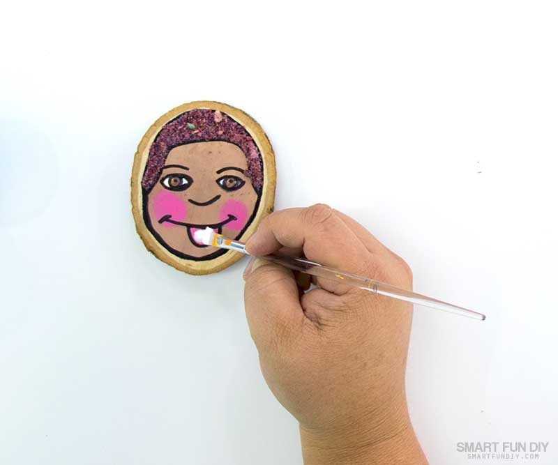 paint glue onto parts of the self portrait