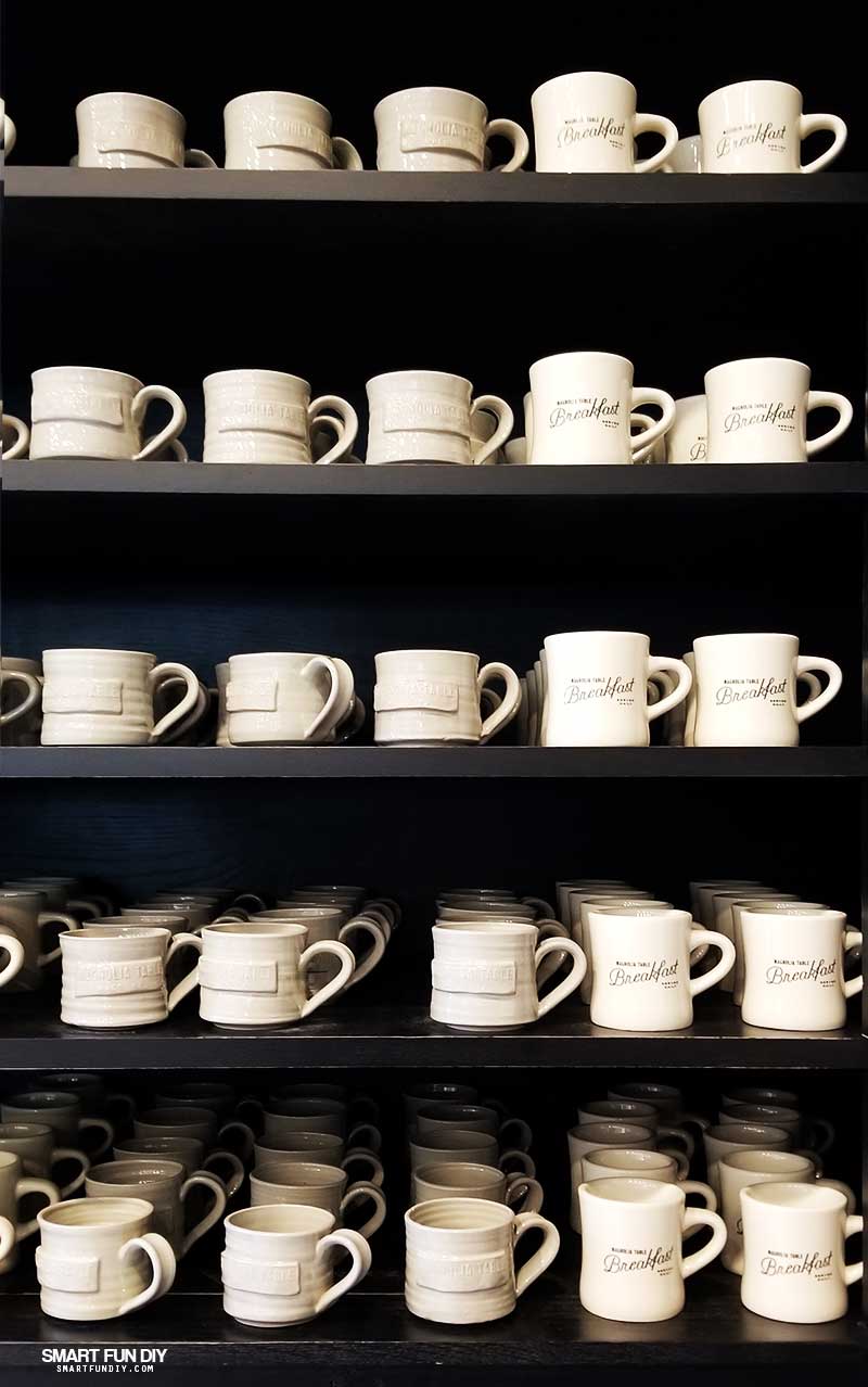 Coffee cup display in Take Away Market at Magnolia Table restaurant