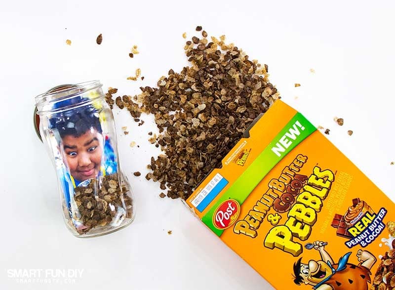 mason jar with photo and peanut butter and cocoa pebbles inside