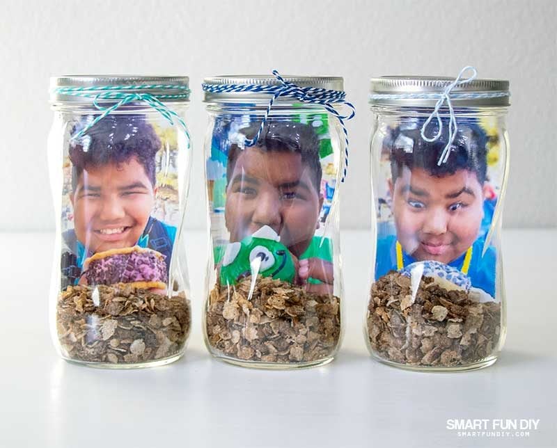 3 scented mason jar centerpieces with photos inside