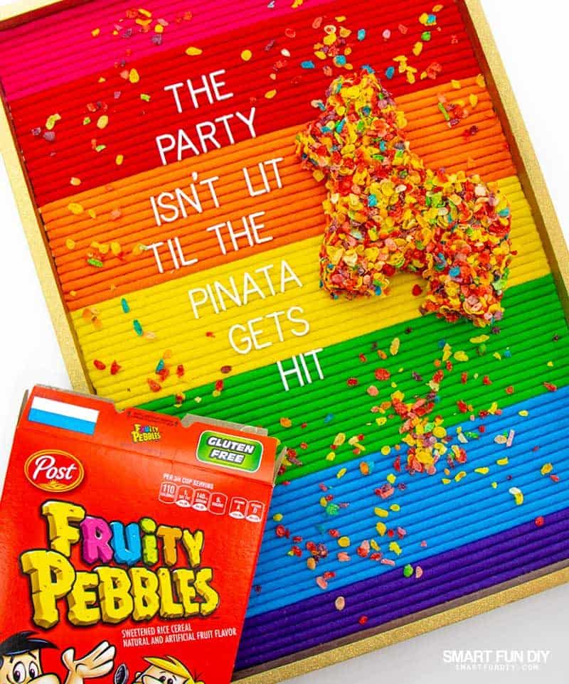 DIY pinata with cereal box and Fruity Pebbles cereal on a letterboard with quote
