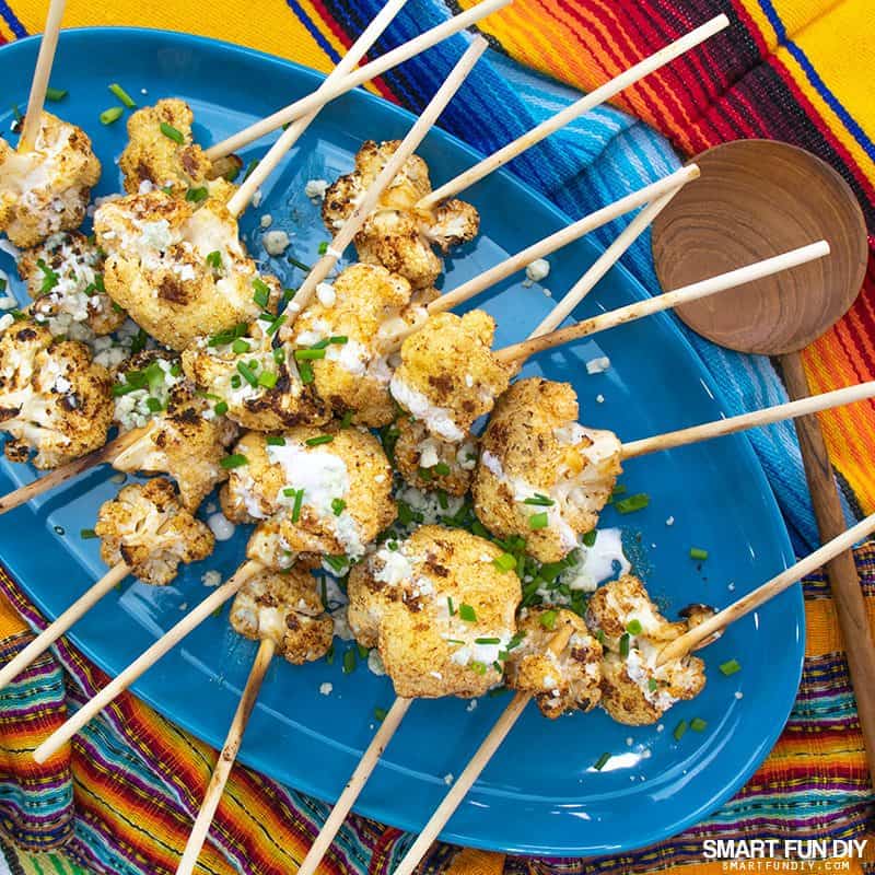 Spicy cauliflower lollipops on a platter Spicy cauliflower lollipops on a platter