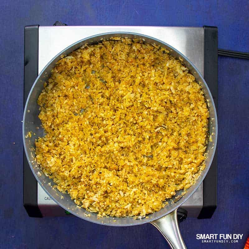 keto mexican cauliflower rice cooking in saute pan