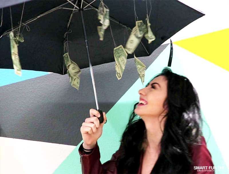 girl reacts to umbrella make it rain money gift idea