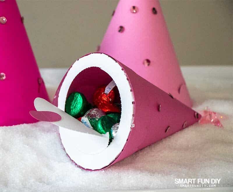 Paper treat cone filled with candy and perforated opening peeled away to reveal candy inside, a Cricut Maker project