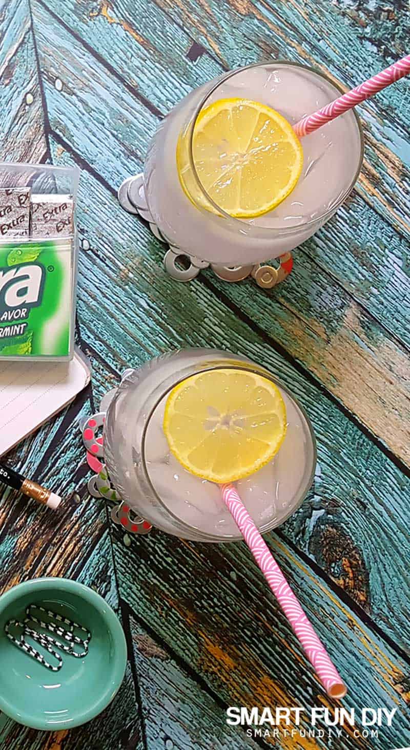 Glasses of lemonade on metal washer coasters painted with nail polish.